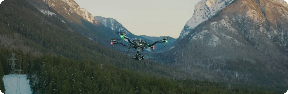 Astro aircraft flying through mountain terrain